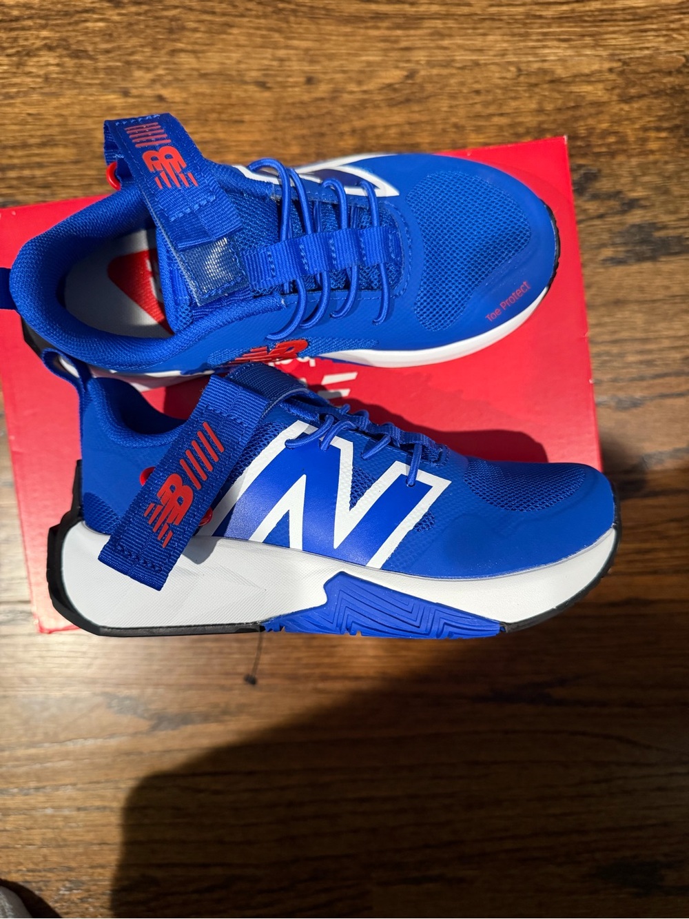 New Balance Kids Blue and White Lace-Closure Sneakers with Red Accents